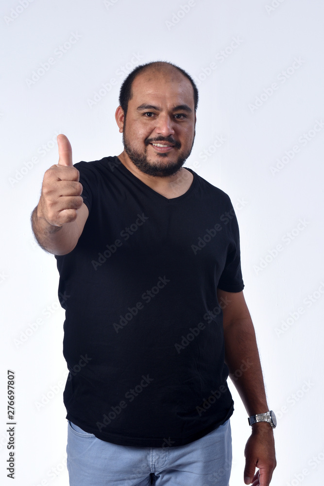latin american man thumps up on white background latin american man thumps up on white background