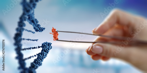Foto DNA molecules design with female hand holding pincers