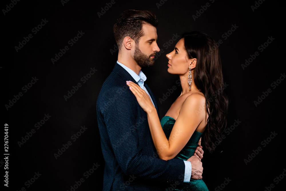 Profile side view portrait of his he her she nice-looking attractive shine glamorous lovely luxurious passionate two person St Valentine day isolated over black background Profile side view portrait of his he her she nice-looking attractive shine glamorous lovely luxurious passionate two person St Valentine day isolated over black background