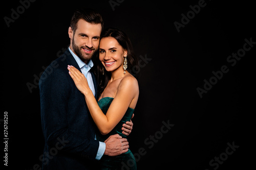 Close up side profile photo beautiful she her wife earrings he him his husband mrs mr married spouse hands slim waist hold close wear costume jacket green cocktail dress isolated black background