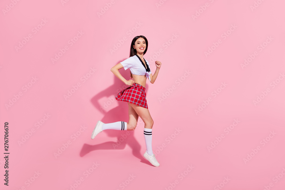 Profile side full length body size view of her she nice-looking attractive charming cheerful cheery straight-haired lady having fun running fast isolated over pink pastel background