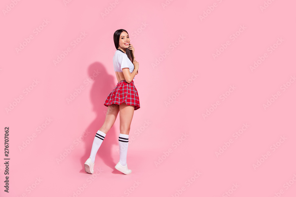 Full length body size view of her she nice-looking attractive lovely winsome well-groomed adorable slender cheerful cheery straight-haired lady walking isolated over pink pastel background Full length body size view of her she nice-looking attractive lovely winsome well-groomed adorable slender cheerful cheery straight-haired lady walking isolated over pink pastel background