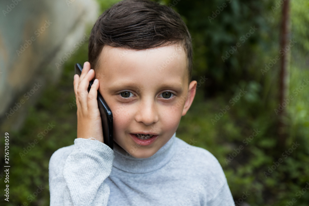 little boy talking on a smartphone little boy talking on a smartphone