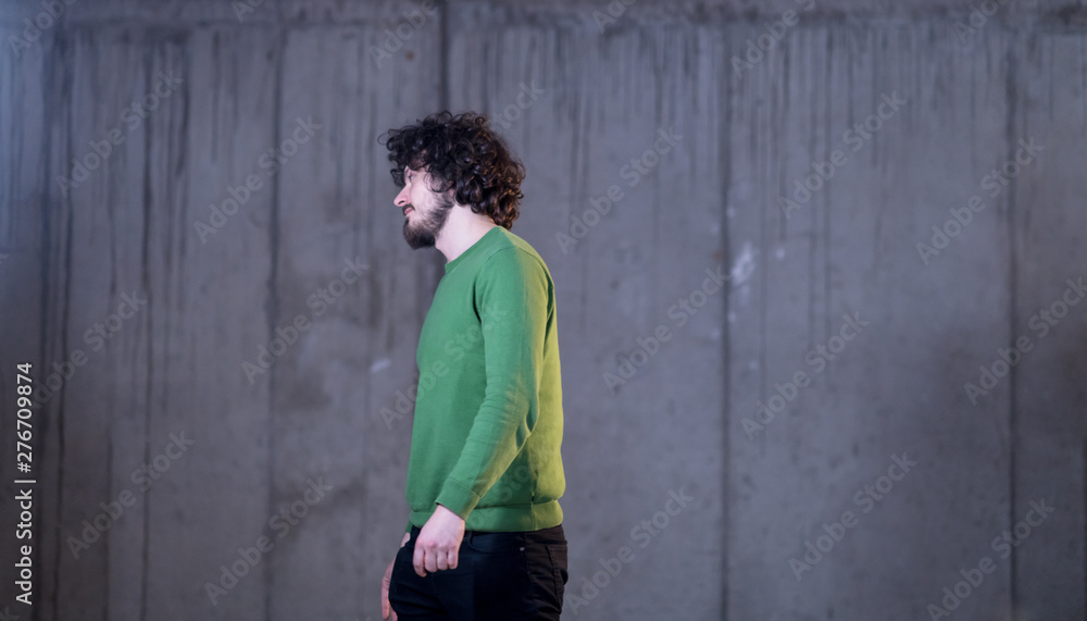 portrait of casual businessman in front of a concrete wall portrait of casual businessman in front of a concrete wall