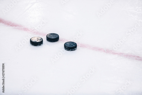 Photography Hockey pucks on ice