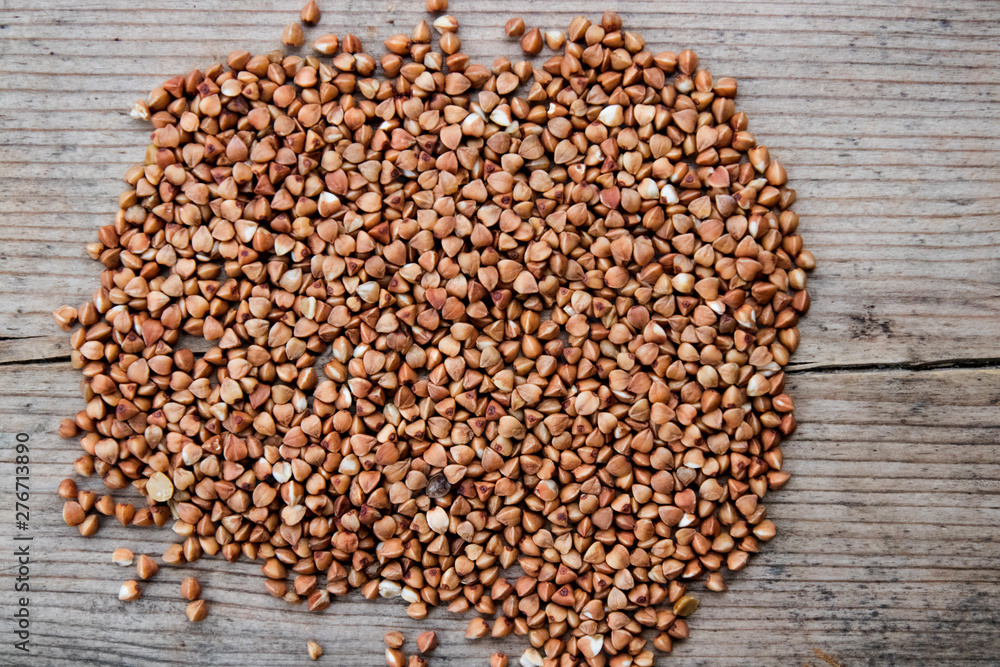 Buckwheat Seeds on a wooden board Buckwheat Seeds on a wooden board