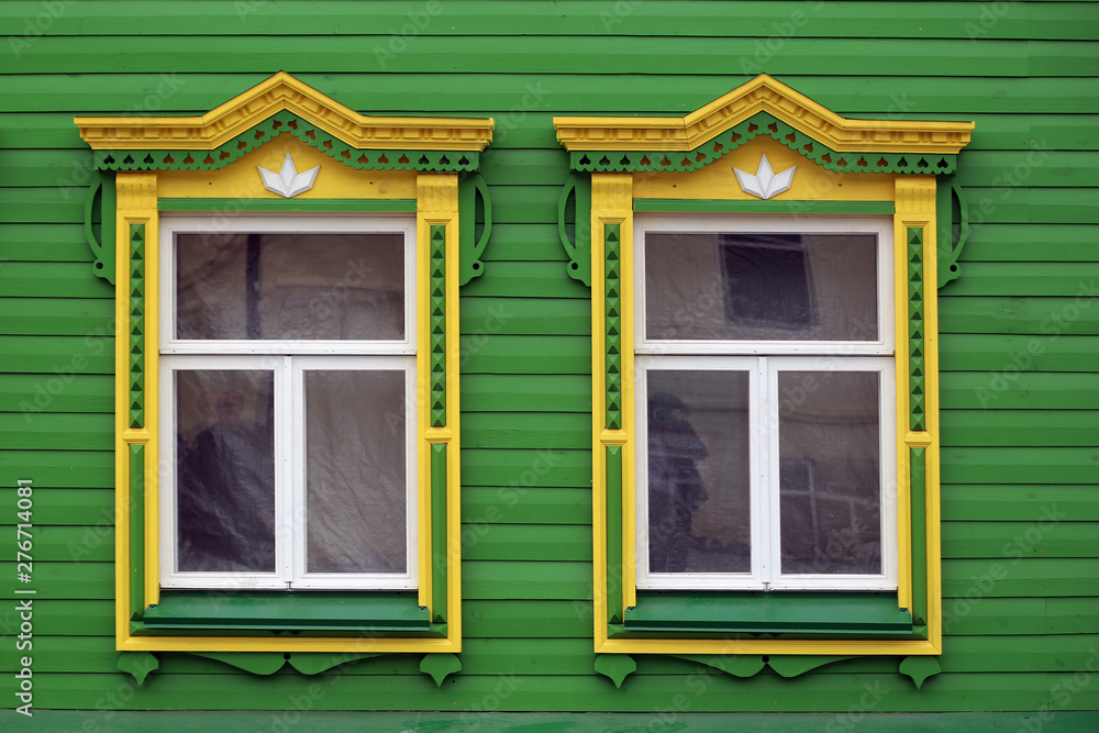 wooden window with carved platbands. wooden window with carved platbands.