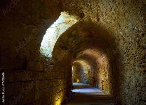 The large distribution gallery, covered by circular barrel vaulting, excavated into natural rock, under the Roman Theatre of the ancient Gades in Hispania, the current city of Cadiz, Andalusia, Spain. photo