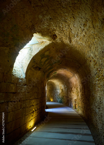 The large distribution gallery, covered by circular barrel vaulting, excavated into natural rock, under the Roman Theatre of the ancient Gades in Hispania, the current city of Cadiz, Andalusia, Spain. photo