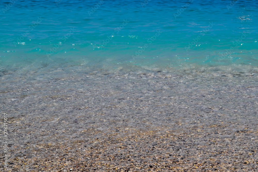 Obraz premium Calm sea or ocean. Blue or azure water color. Clear and blue sky. Sunny summer weather. Beach, cruise, tropical island.