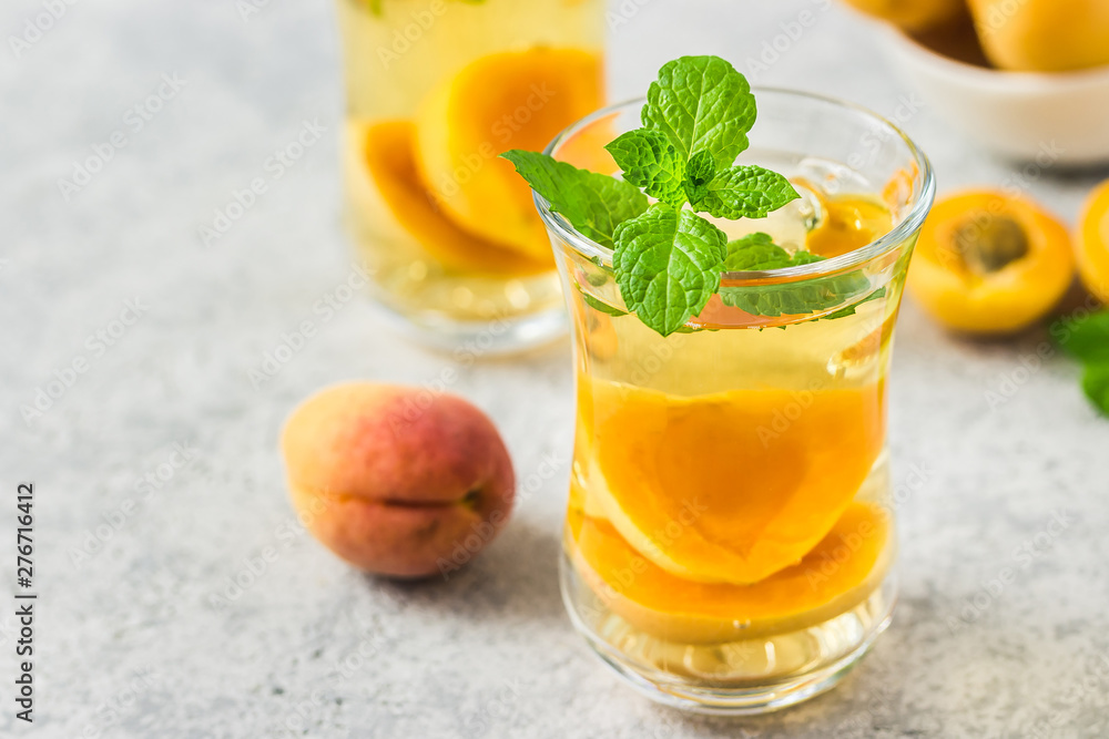 Fototapeta premium Summer drink, apricot mint tea. Selective focus, space for text.