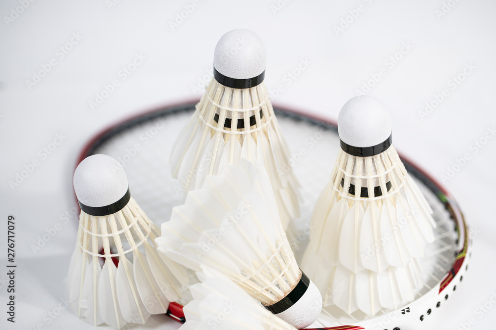 white badminton shuttlecocks lay on white table background