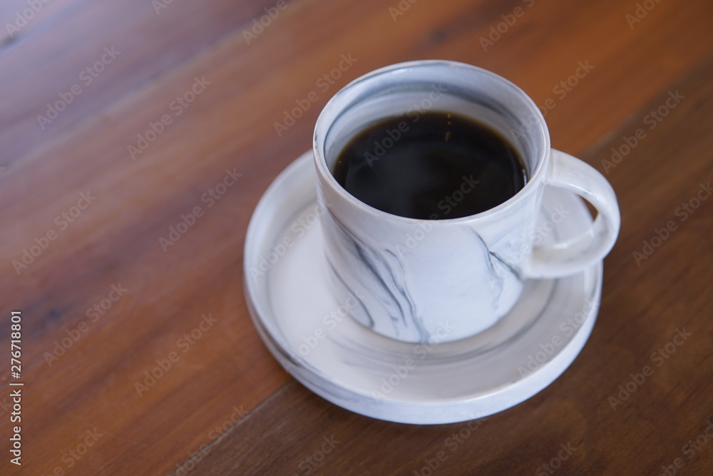 cup of coffee on wooden table cup of coffee on wooden table