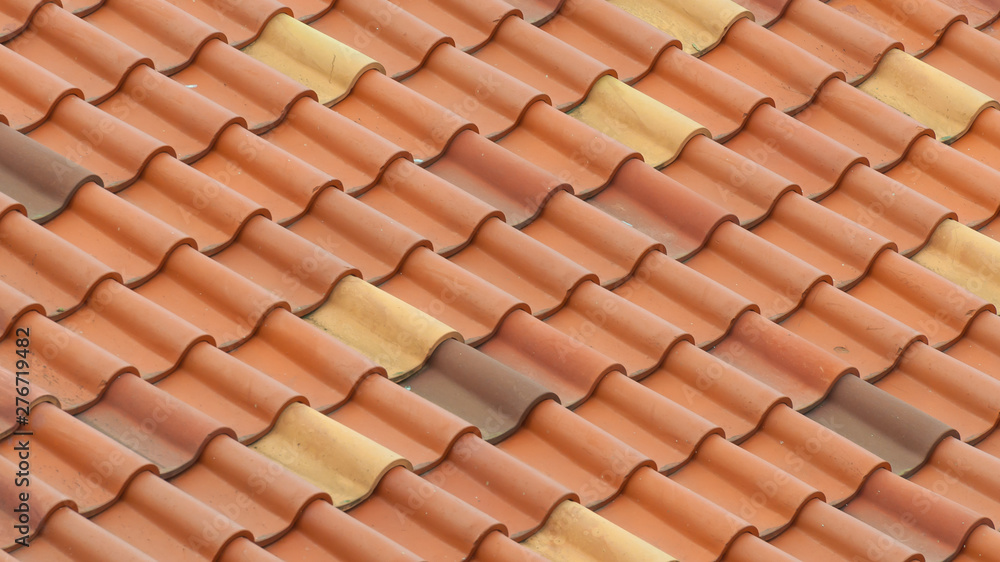 The roof is covered with red tiles. Background. The roof is covered with red tiles. Background.