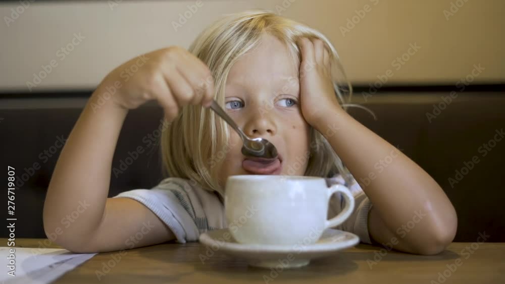 Boy Blowing On Hot Tea Boy Blowing On Hot Tea