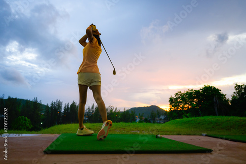 woman driving practice golf training for a better hit in course, practice for winning competitive