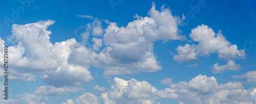 Panorama of blue sky with white cumulus clouds