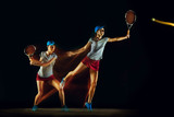 One caucasian woman playing tennis isolated on black background in mixed and stobe light. Fit young female player in motion or action during sport game. Concept of movement, sport, healthy lifestyle.