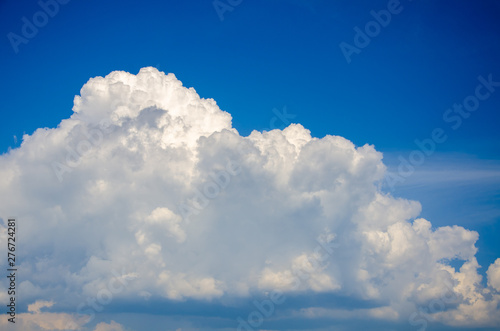 Blue sky background with white cumulus clouds