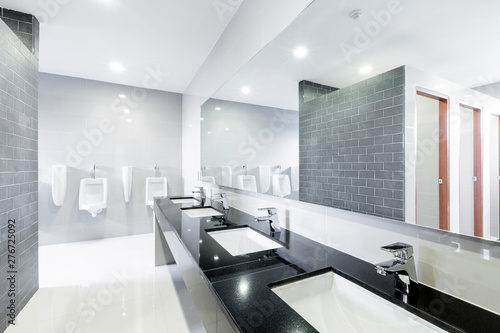 public Interior of bathroom with sink basin faucet lined up Modern design. photo