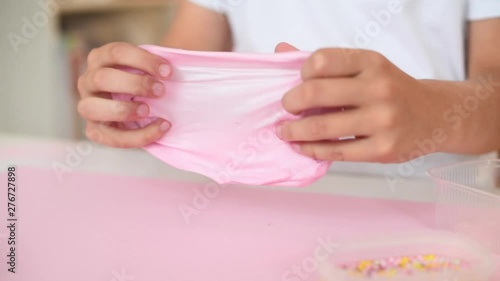 child play with pink slime. playing with slime.