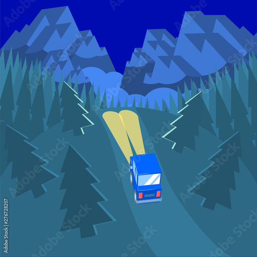 A lonely car with headlights on at night drives along a road into a dark and gloomy wild forest. Ahead of the snowy mountains with fog.