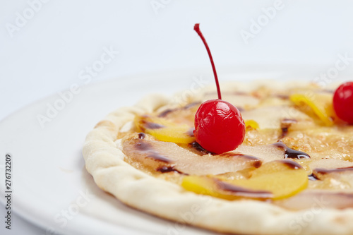 sweet pizza with chocolate and cherries