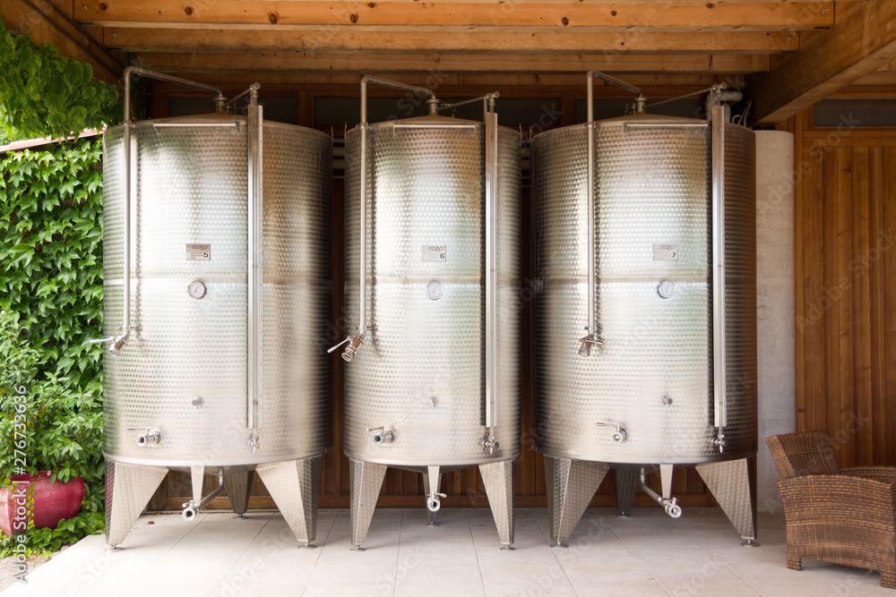 Treviso, Italy, 06/23/2019, stainless steel wine containers in a wine factory. Treviso, Italy, 06/23/2019, stainless steel wine containers in a wine factory.