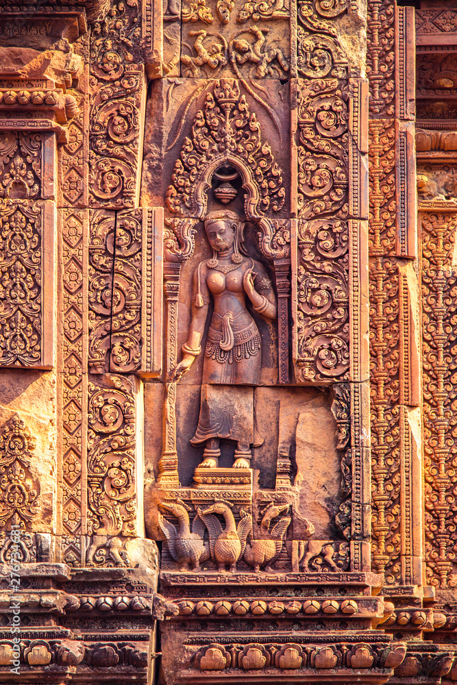 Devata or Goddess carved into the red sandstone walls, Banteay Srei temple, Siem Reap, Cambodia