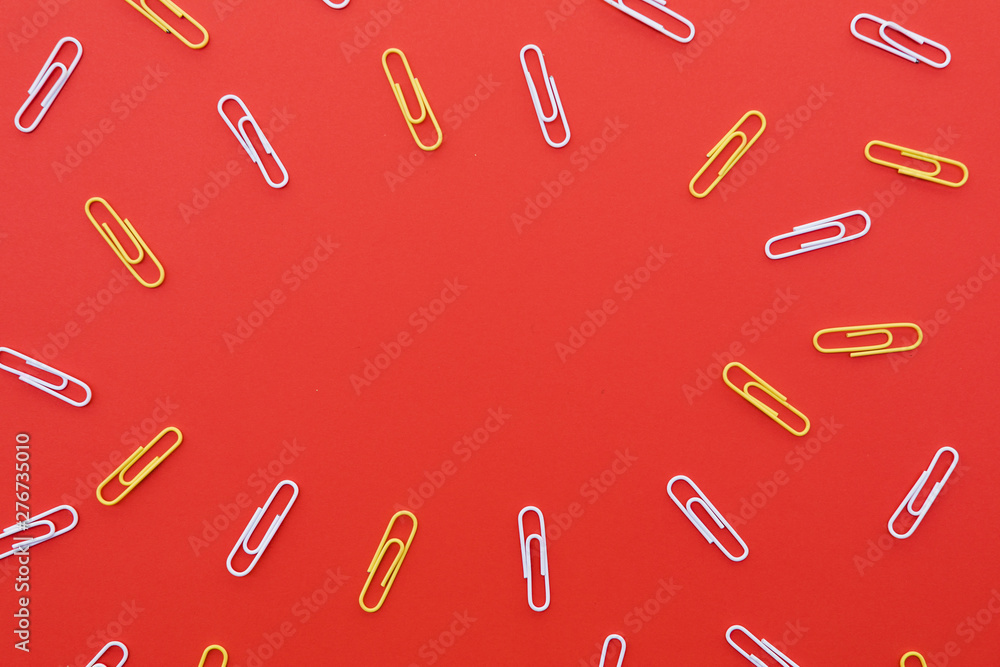 Paper clips on red background Paper clips on red background