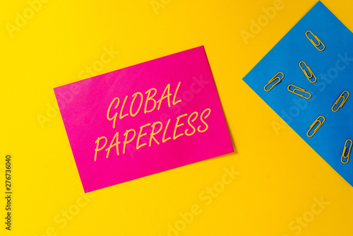 Conceptual hand writing showing Global Paperless. Concept meaning going for technology methods like email instead of paper Blank paper sheets message reminder clips binders color background