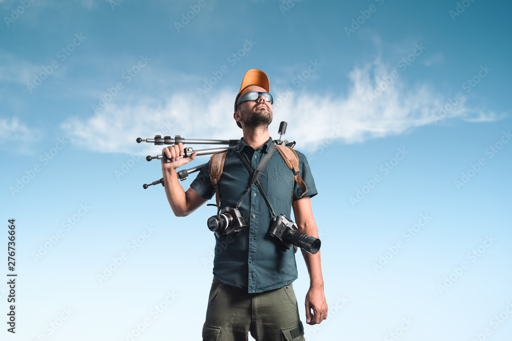 Portrait of a photographer with photographic equipment. Portrait of a photographer with photographic equipment.