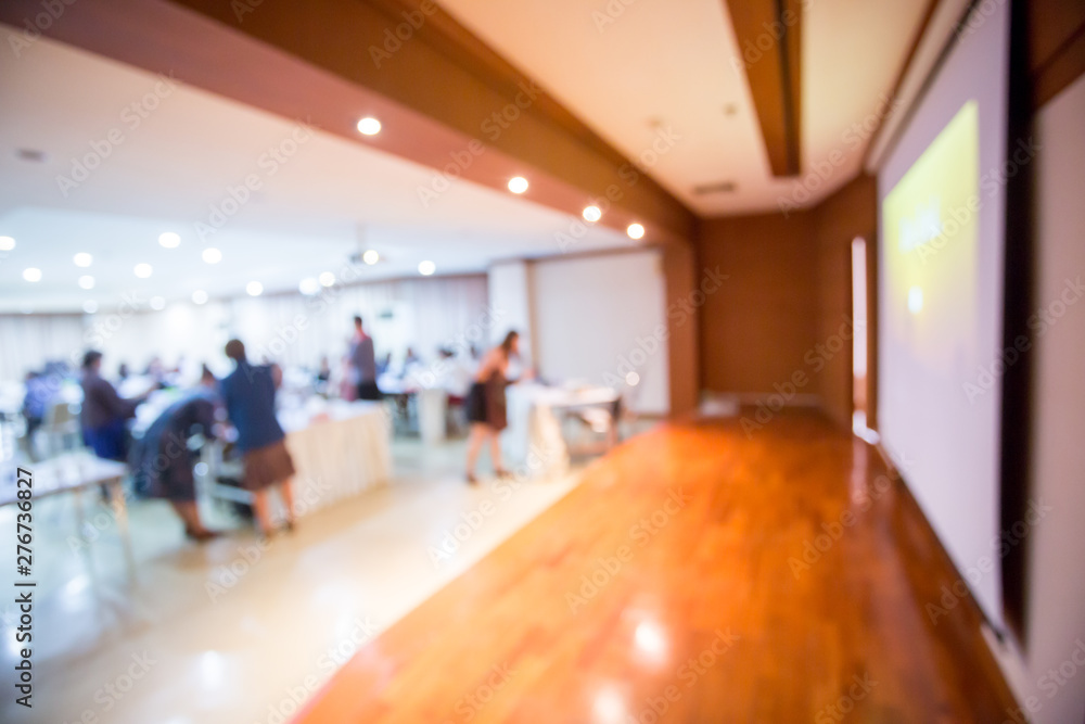 blurry image. display screen and projector for business presentation at the foreground in meeting room. speaker with business team on meeting workshop. blurry image. display screen and projector for business presentation at the foreground in meeting room. speaker with business team on meeting workshop.