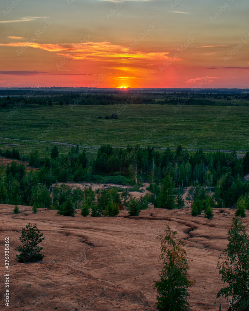 Fototapeta premium sunset over hill