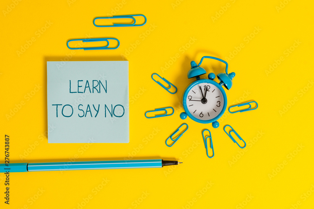 Word writing text Learn To Say No. Business photo showcasing decline or refuse few things before you destroy yourself Metal alarm clock wakeup clips ballpoint notepad colored background Word writing text Learn To Say No. Business photo showcasing decline or refuse few things before you destroy yourself Metal alarm clock wakeup clips ballpoint notepad colored background