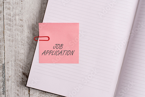 Writing note showing Job Application. Business concept for The standard business document serves a number of purposes Notebook stationary placed above classic wooden backdrop photo