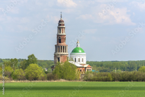 High old bell tower and Church in the Ryazan region of Russia, the village of Perevles. photo