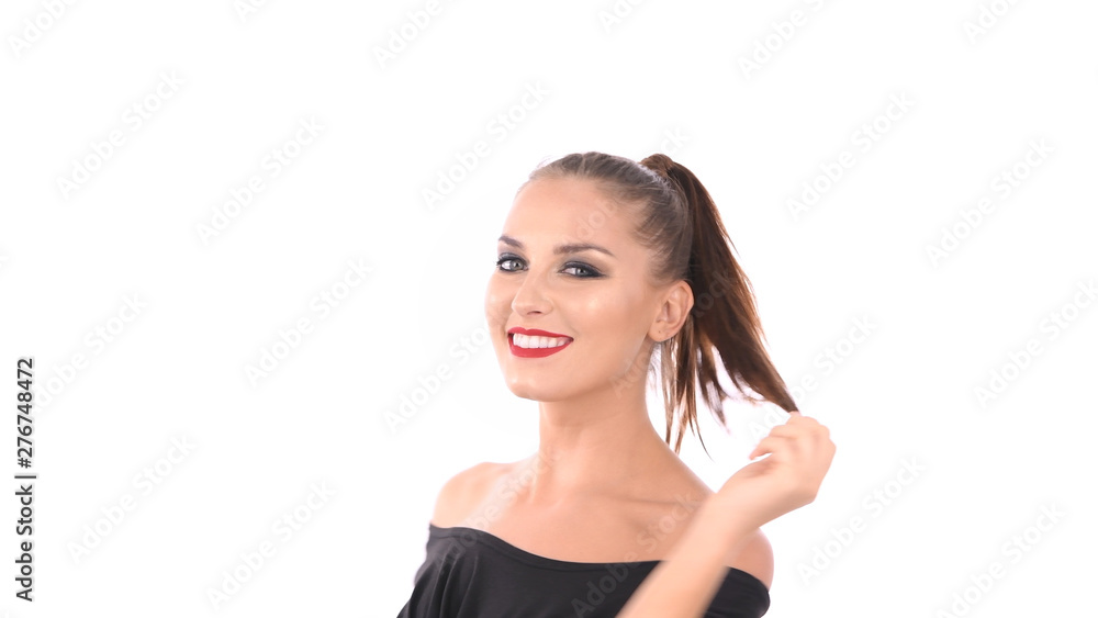 Beauty concept. A charming woman is fondling her face on a white background. Beauty concept. A charming woman is fondling her face on a white background.