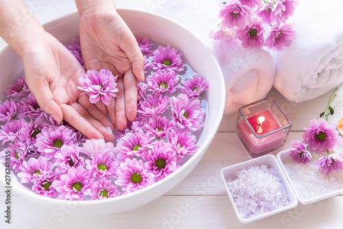 Canvas Print Spa treatment and product for female feet and manicure nails spa with pink flower and rock stone, copy space, select focus, Thailand