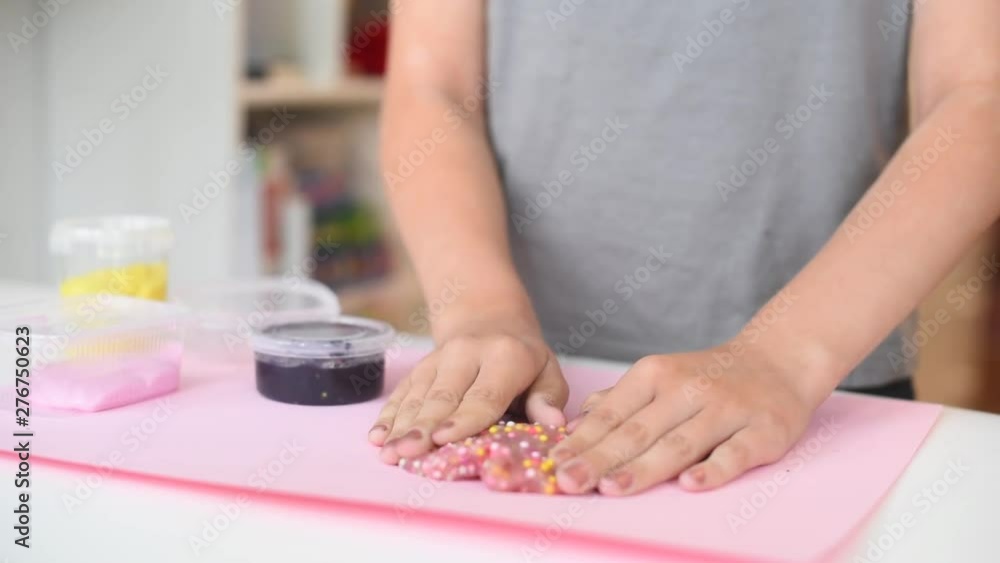 child play with pink slime. playing with slime. child play with pink slime. playing with slime.