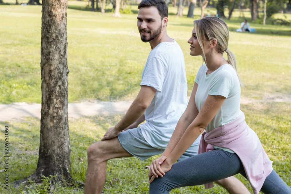Couples are exercising in the park. Couples are exercising in the park.
