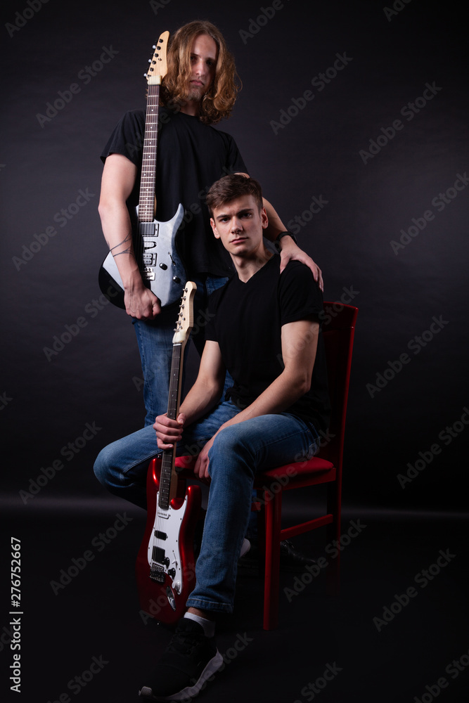 Rock band consisting of two young caucasian adults Rock band consisting of two young caucasian adults
