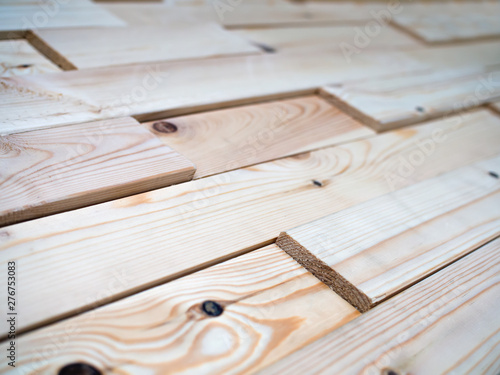 Decorative panels assembled from the boards of natural wood