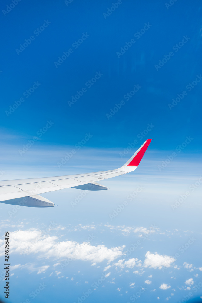 Fototapeta premium aircraft Wing on cloudscape and blue sky