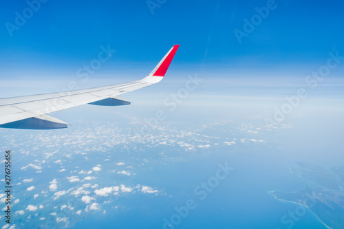 aircraft Wing on cloudscape and blue sky