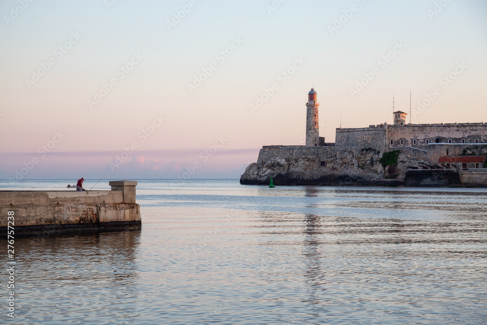 Beautiful view of the Lighthouse in the Old Havana City, Capital of Cuba, during a colorful and sunny sunrise.