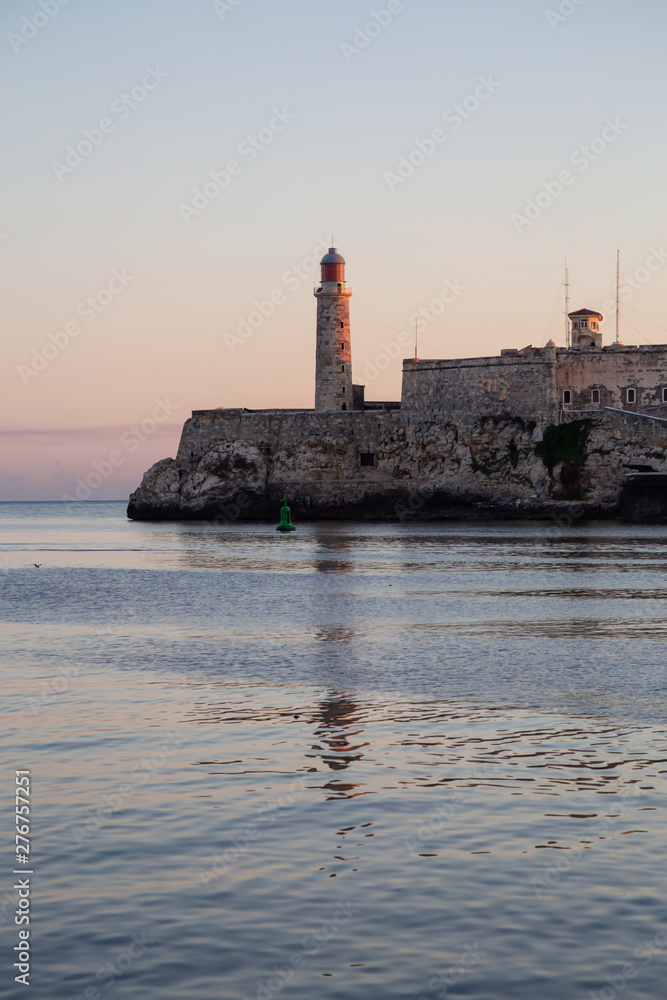 Beautiful view of the Lighthouse in the Old Havana City, Capital of Cuba, during a colorful and sunny sunrise.