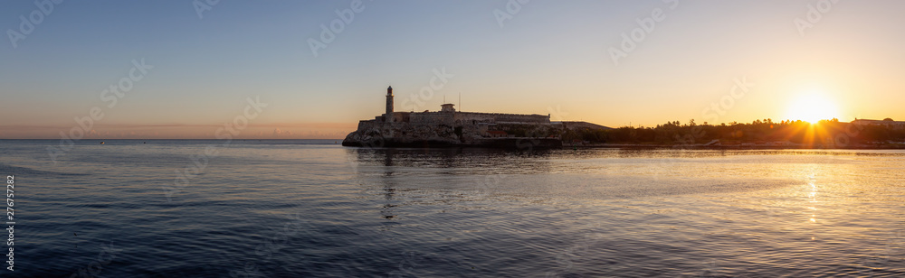 Panoramic view of the Lighthouse in the Old Havana City, Capital of Cuba, during a colorful and sunny sunrise.