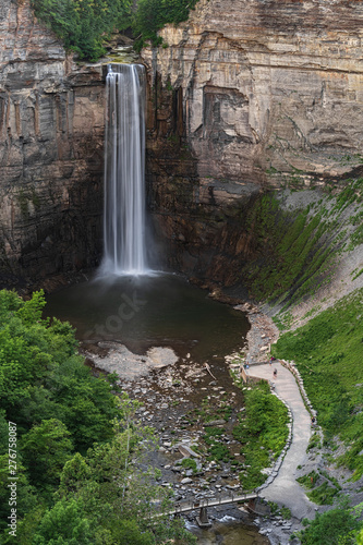 Taughannock Falls found in the Finger Lakes (Cayuga) region of upstate New York. The main fall is higher than that of Niagara Falls. View from the top with people down there watching.