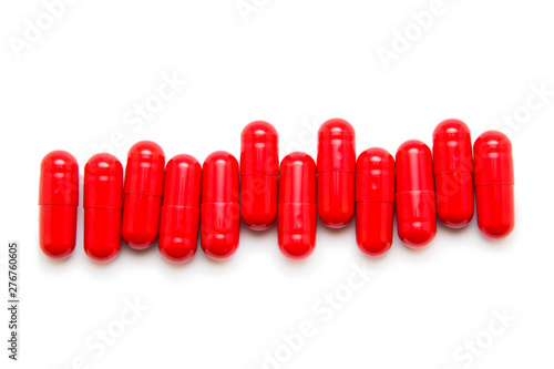 Red pill isolated on white